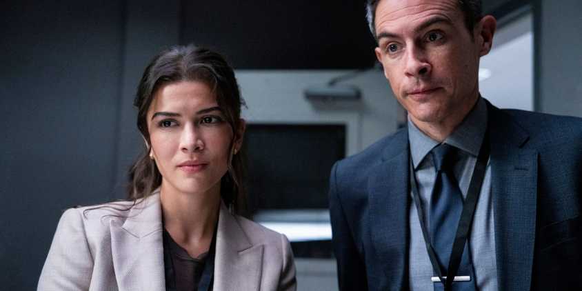 Syd and Scola standing together and looking straight ahead in FBI season 7