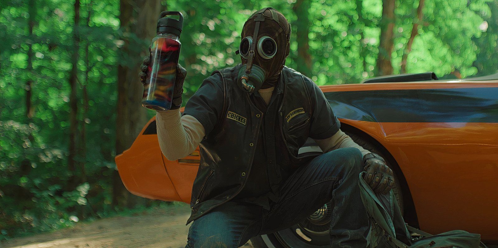 A man in a gasmask holds up a bottle of poison in Peacock's Teacup