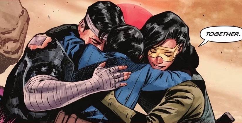 Comic book panel: absolute superman's kal-el hugs his parents