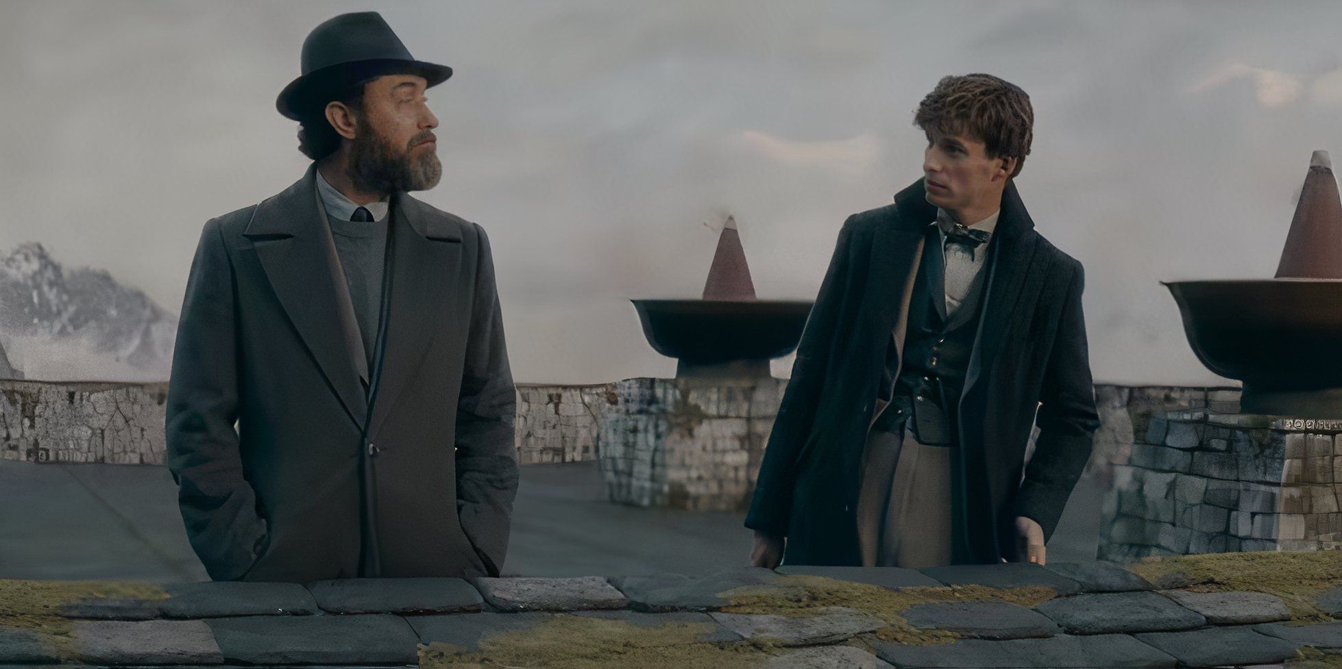 Albus Dumbledore and Newt Scamander talking on a roof in The Secrets of Dumbledore