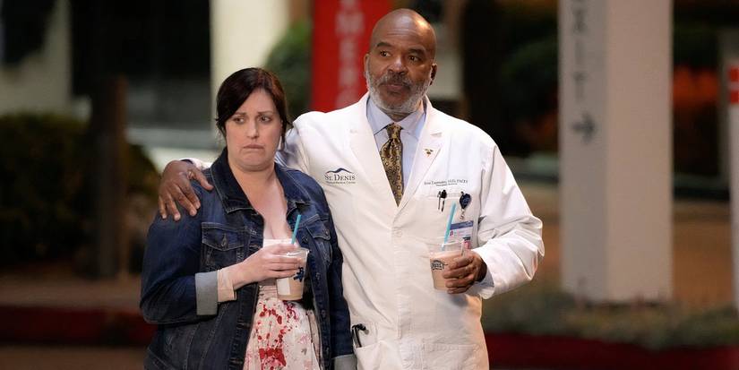 Alex and Ron holding each other in St Denis Medical