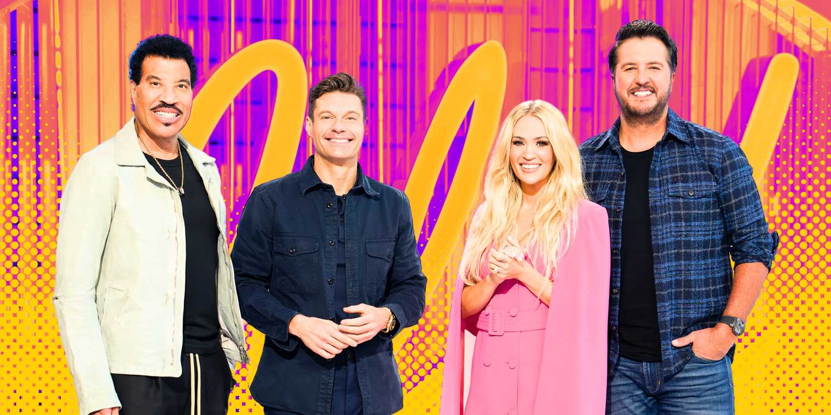 American Idol's Lionel Richie, Ryan Seacrest, Carrie Underwood and Luke Bryan smile in front of the Idol logo.