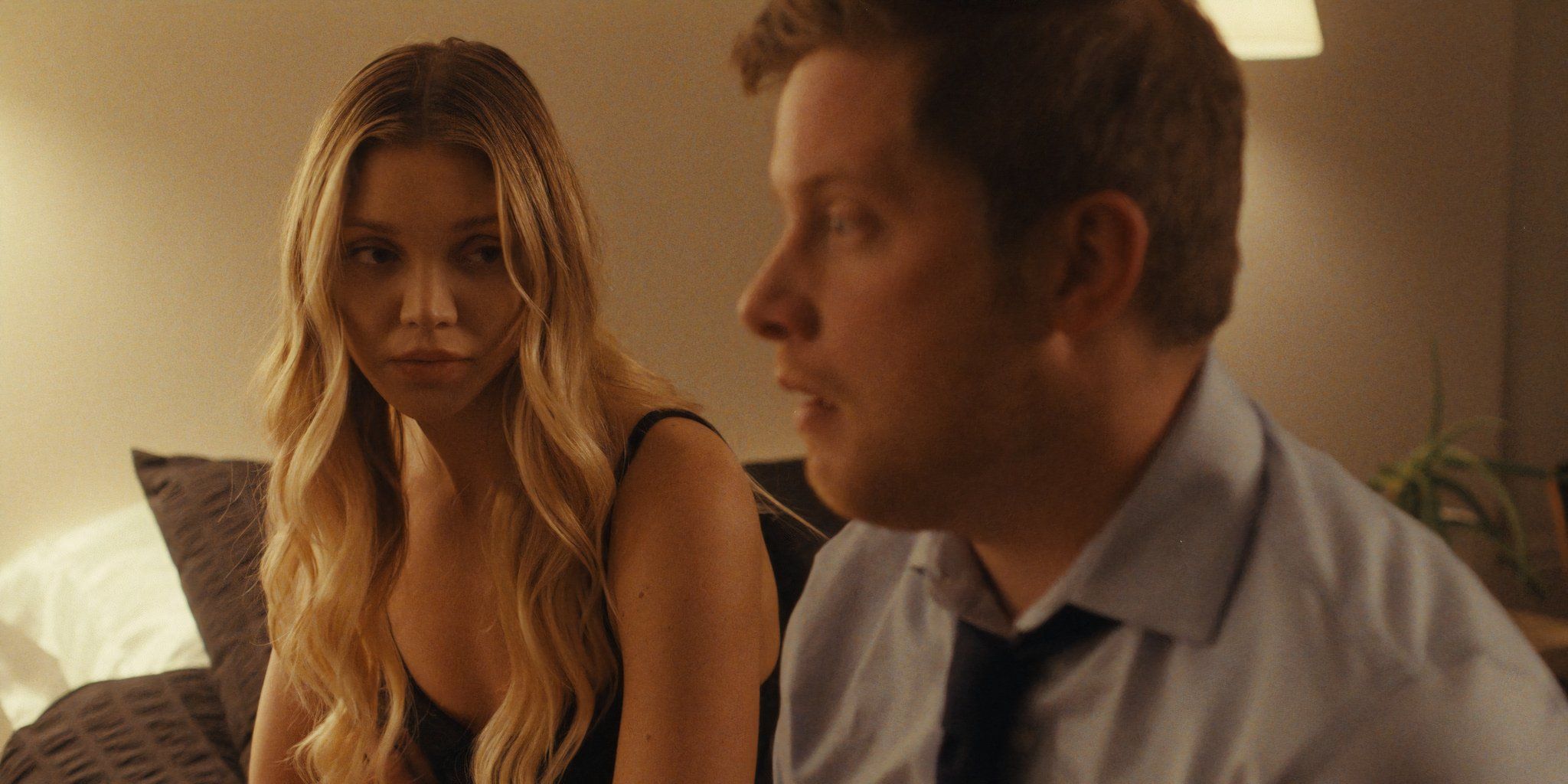 Anna and Josh sit together in Love Bomb