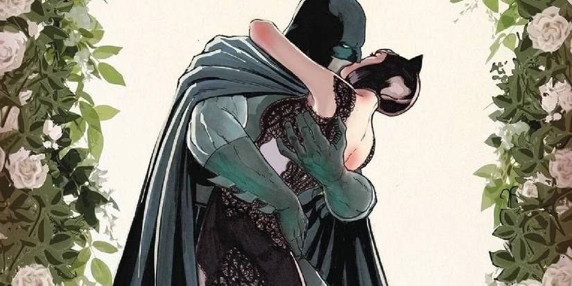 Comic book art: Batman kisses Catwoman in her wedding dress.