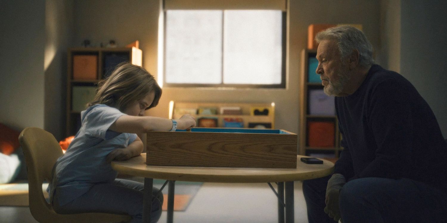 Eli and Noah are across from each other with the sand therapy box in between them in Before.