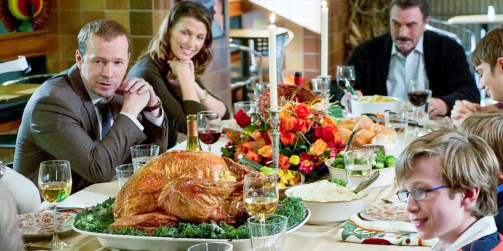 Blue Bloods The Reagans sitting at the dinner table with a Thanksgiving turkey in front of Danny