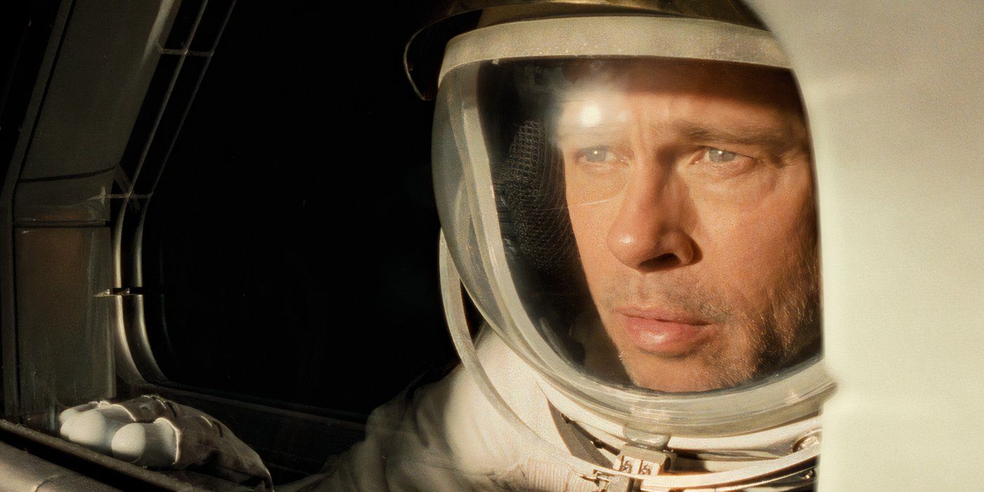 Brad Pitt looking out of a window in a space suit in Ad Astra.