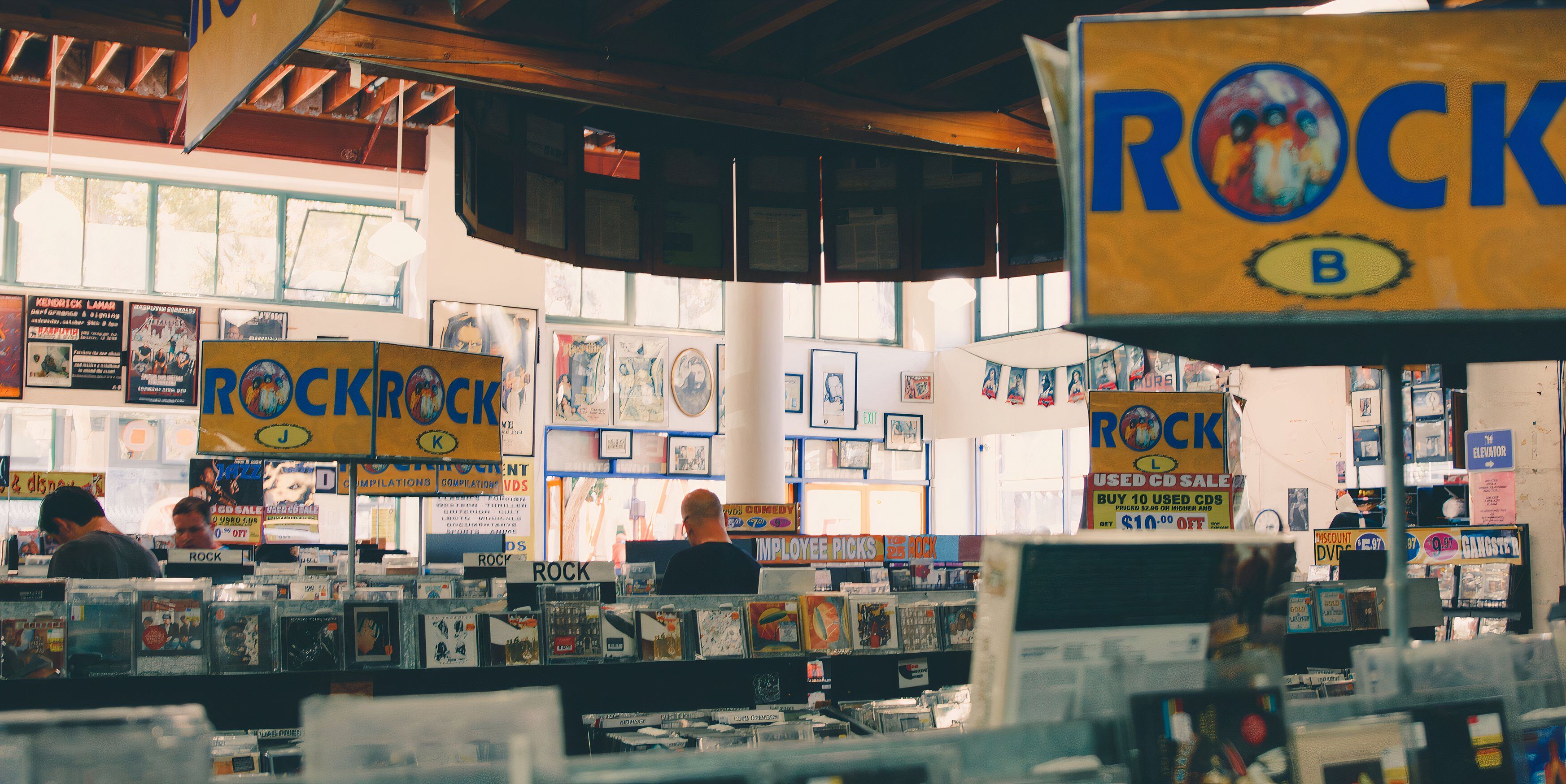 An old-school record store, with signage indicating this is the rock section