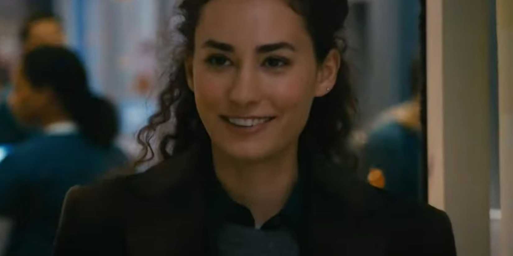 Chicago Med Reese smiling as she walks into a treatment room
