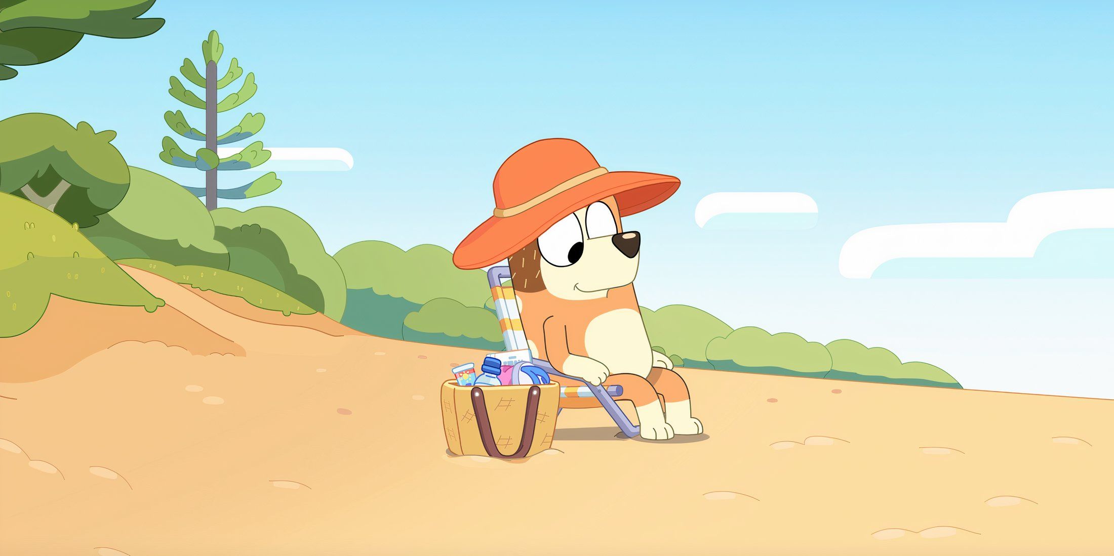 Chili está sentada en la playa en el episodio Bluey Relax.