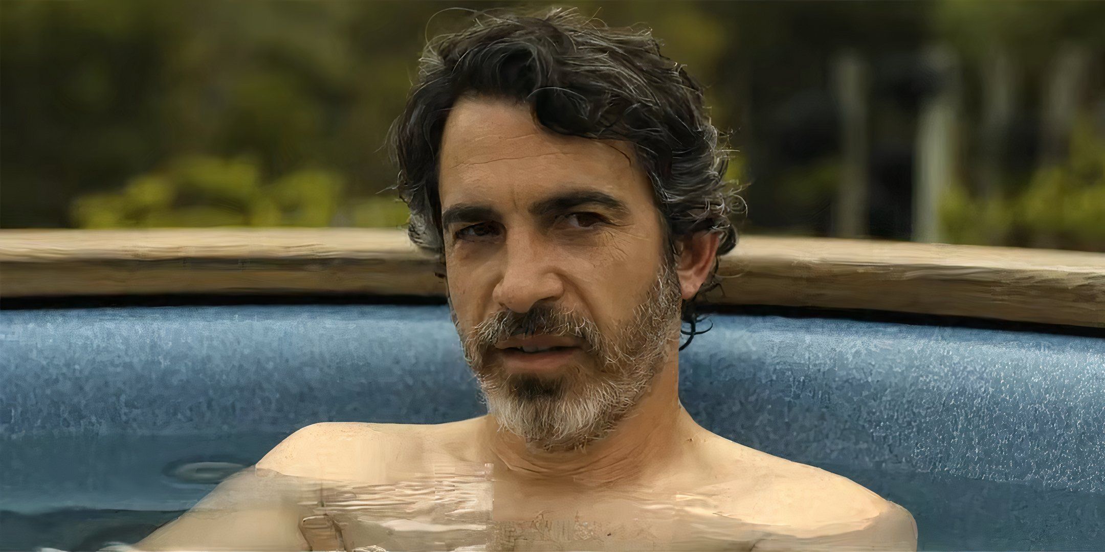 Chris Messina's Nathan looking suspiciously while in a hot tub in Based on a True Story season 2