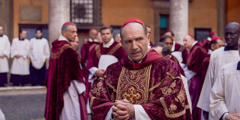 Ralph Fiennes with his hands clasped in Conclave