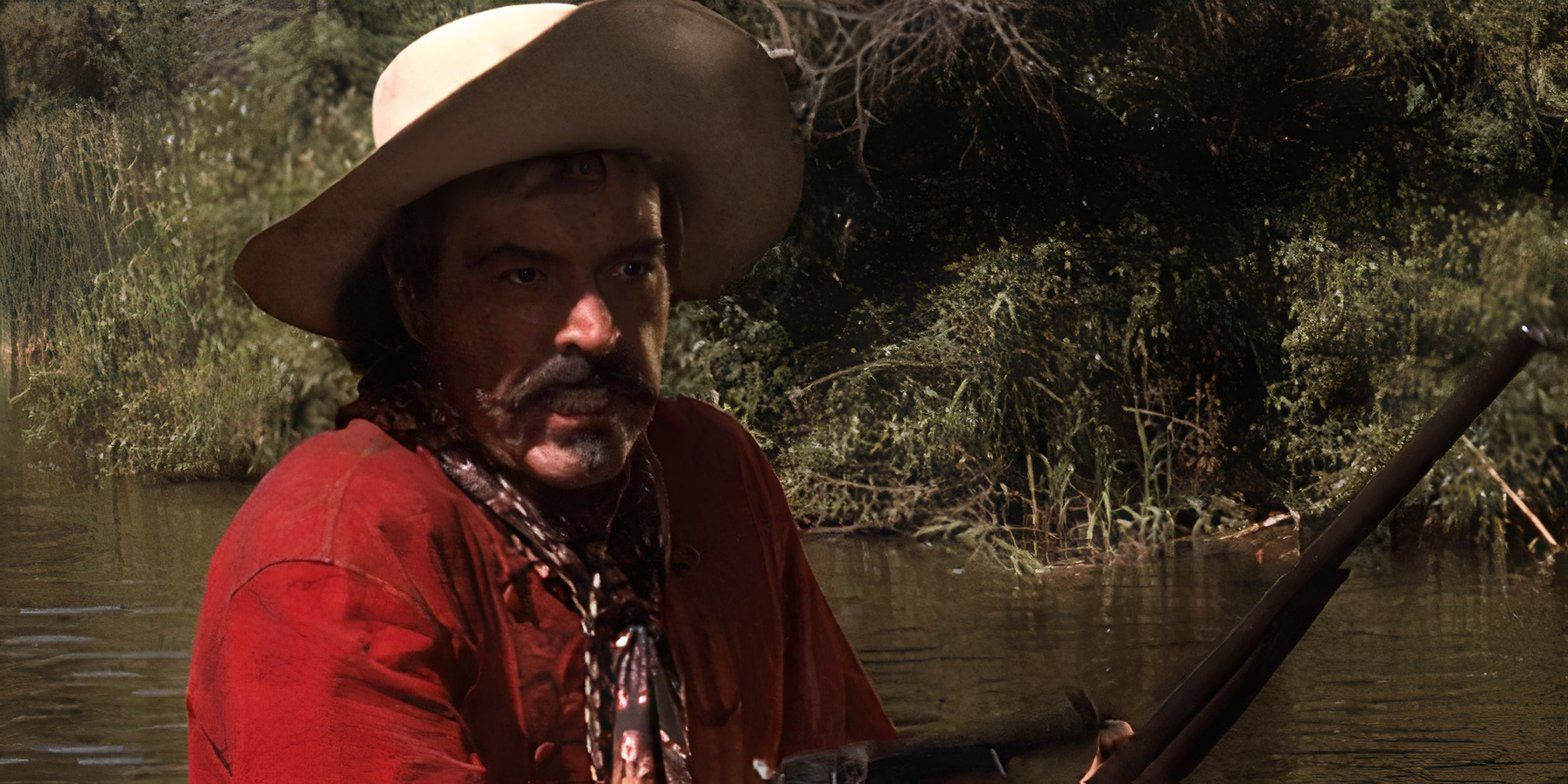 يبدو Curly Bill Brocius (Powers Boothe) غاضبًا أثناء حمل بندقية في Tombstone