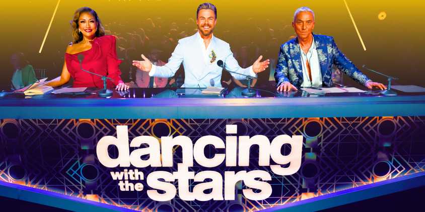 Dancing With The Stars Season 33's Judges carrie ann, derek hough, and bruno behind the dwts judges desk