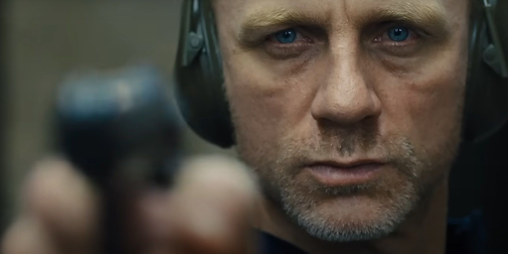 Daniel Craig holding a gun in Skyfall