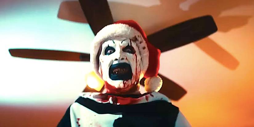 David Howard Thornton's Art the Clown grits his teeth while standing in front of a ceiling fan in Terrifier 3