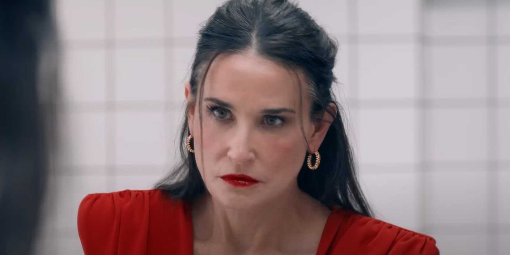 Demi Moore looking in the mirror in The Substance