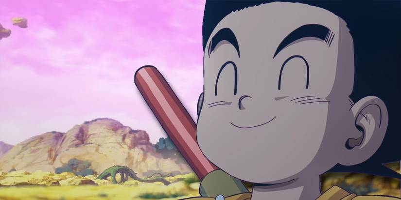 Goku smiling in front of a backdrop of the Demon Realm.