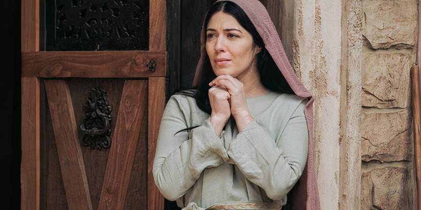 Elizabeth Tabish as Mary Magdalene clasping her hands in The Chosen