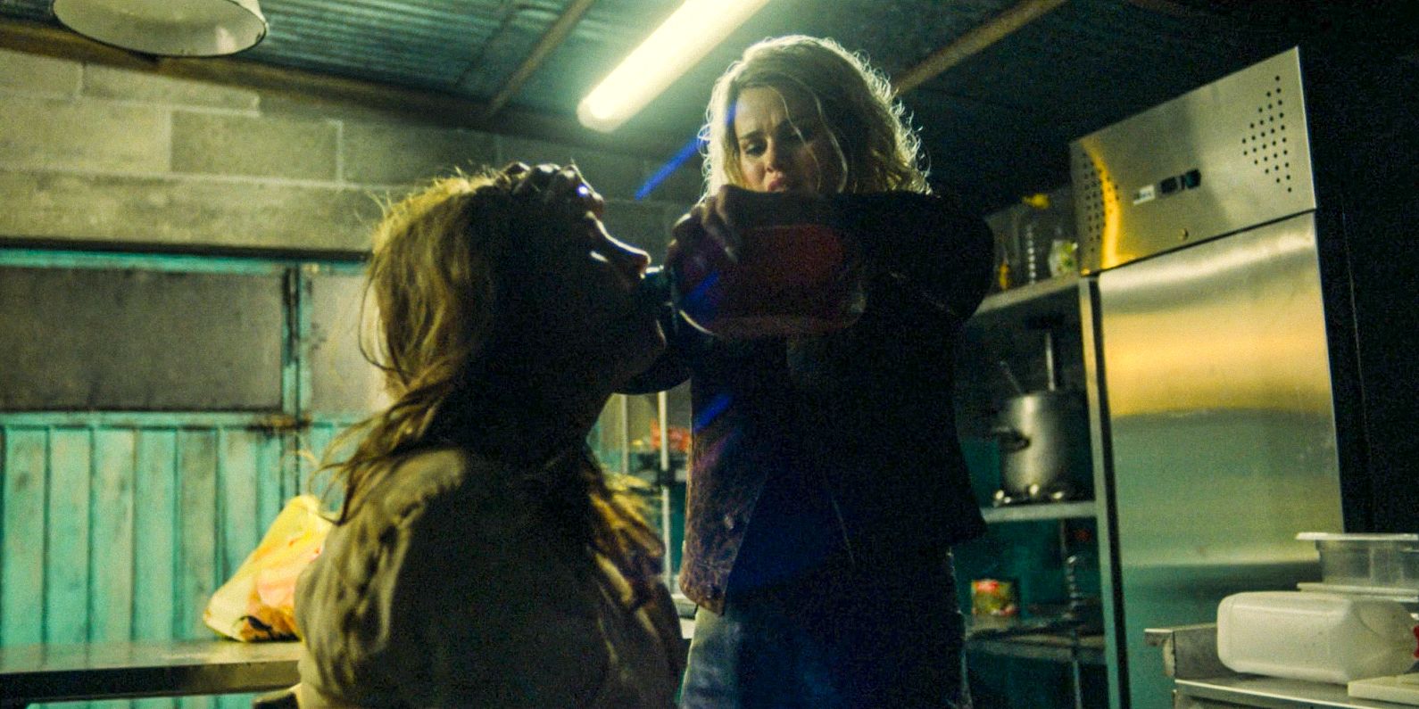 Selena Gomez Jessi kidnaps Karla Sofía Gascón as Emilia Pérez and gives her water to drink in Emilia Pérez