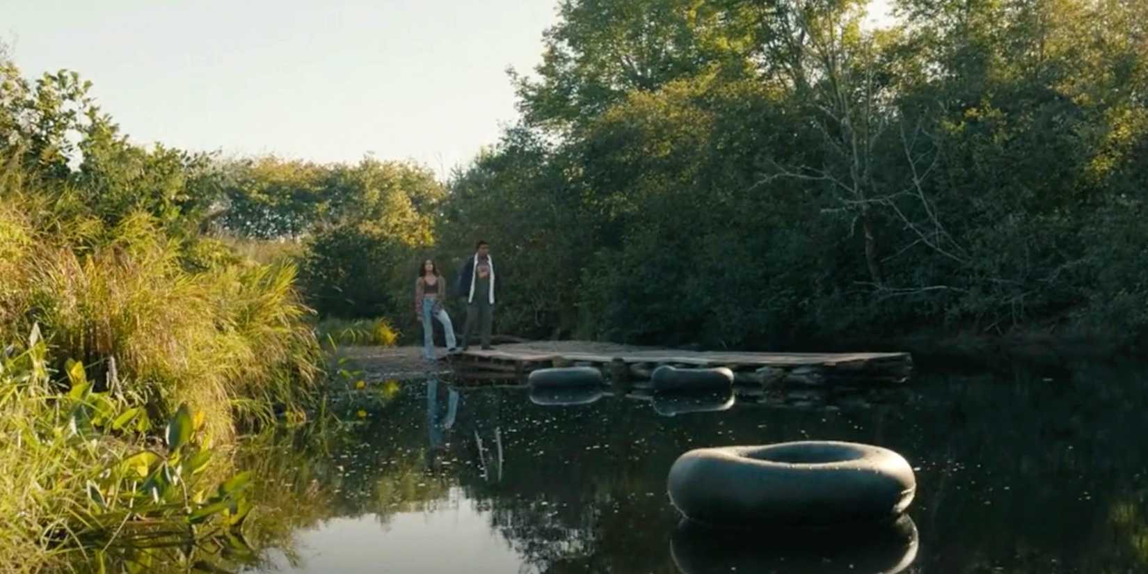 Fatima and Elgin stand on the dock at the Brundles in From season 2