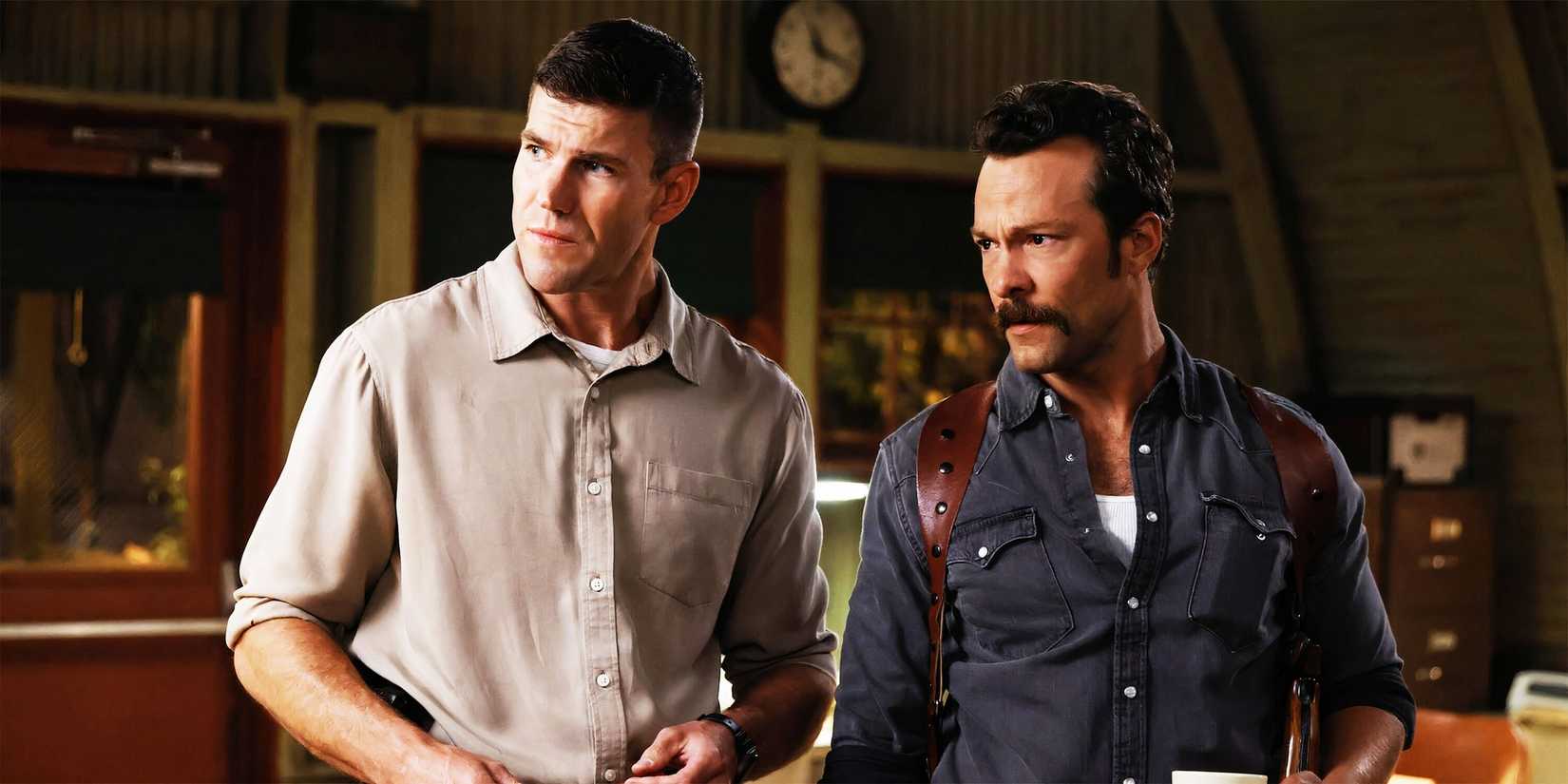 Gibbs (Austin Stowell) and Franks (Kyle Schmid) standing together in NCIS: Origins season 1, episode 5