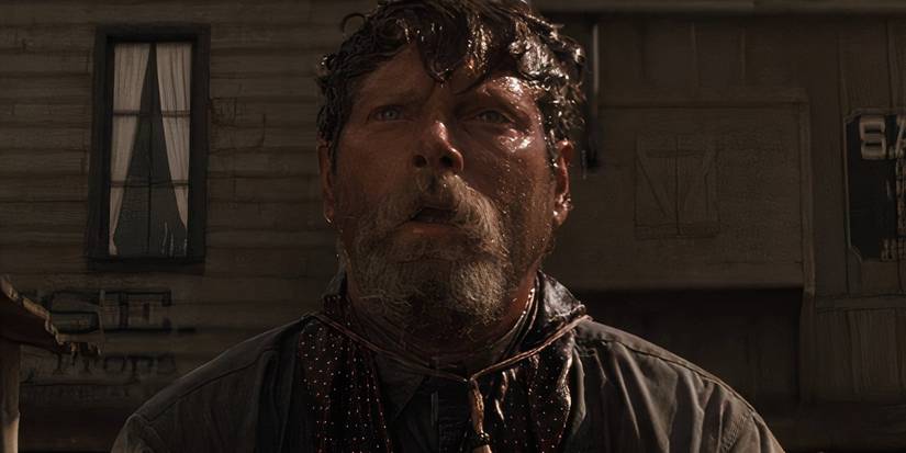 Ike Clanton (Stephen Lang) with his head soaking wet in Tombstone