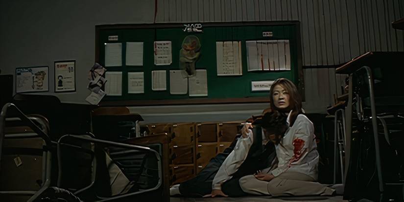 Eun-young and Ji-oh sit together in Whispering Corridors