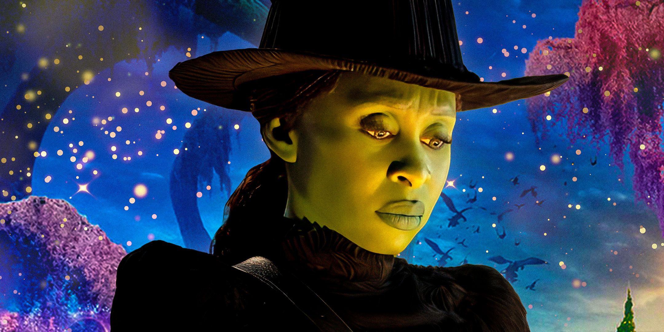 Cynthia Erivo as Elphaba looking down with a blue night sky background in Wicked