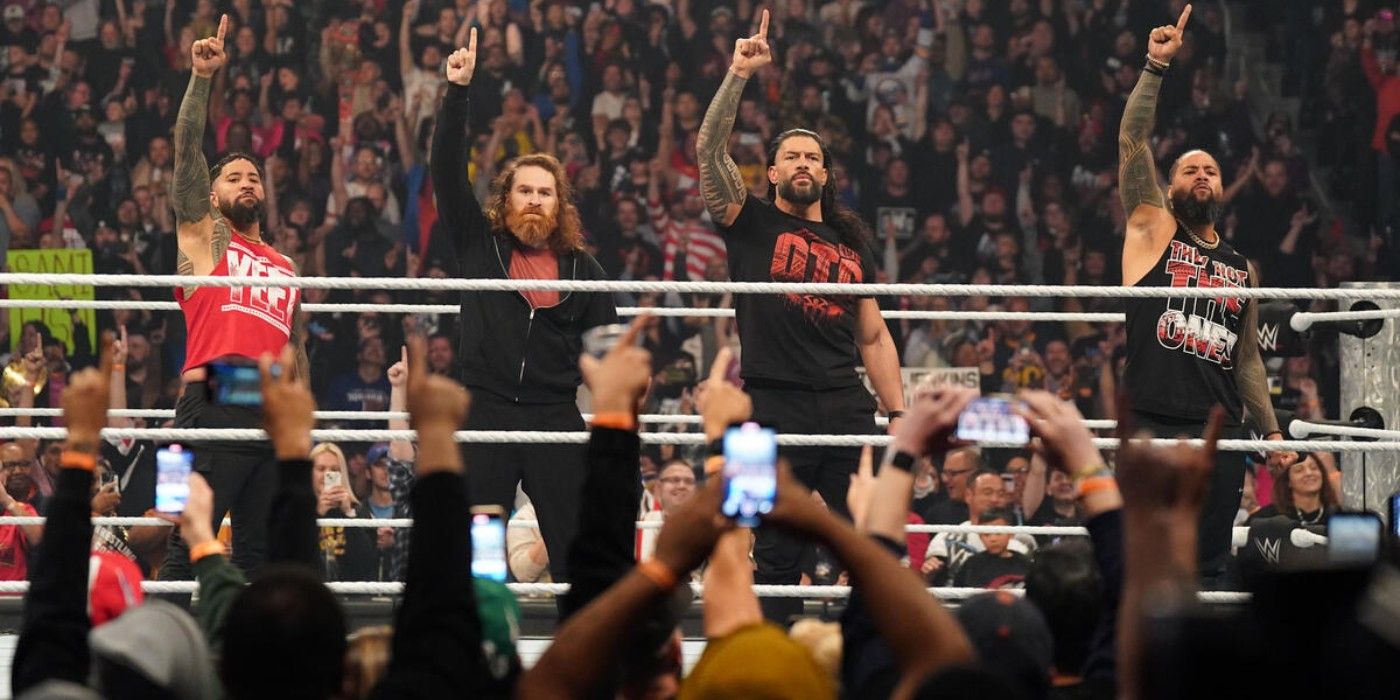 Jey Uso Jimmy Uso The Usos Sami Zayn and Roman Reigns put the ones up as a reunited Bloodline on WWE Friday Night SmackDown