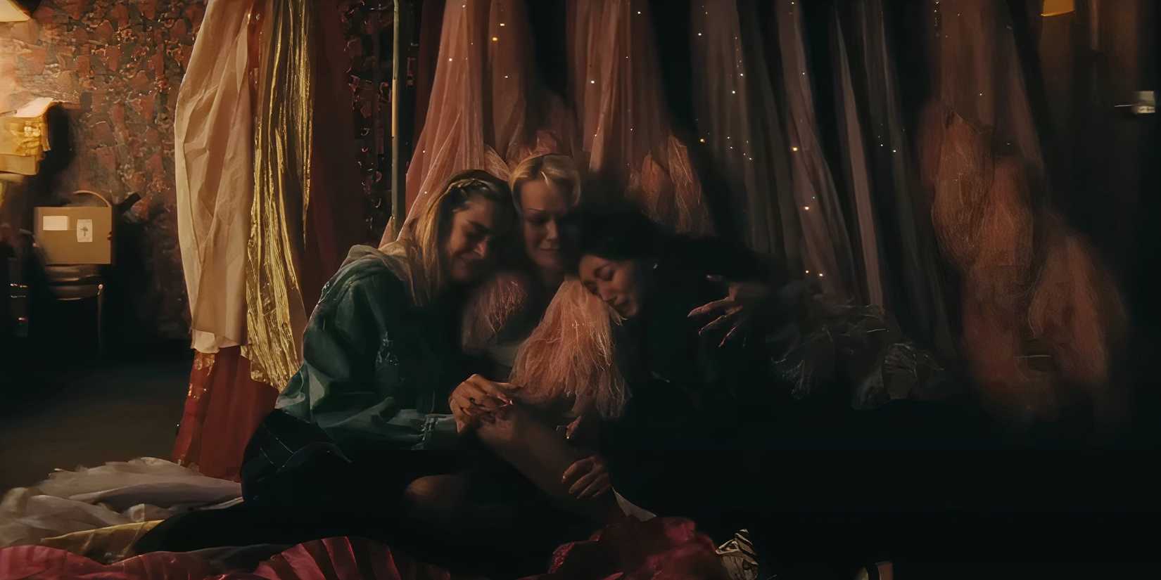 Kiernan Shipka's Jodie and Brenda Song's Mary-Anne hugging a crying Shelly in The Last Showgirl