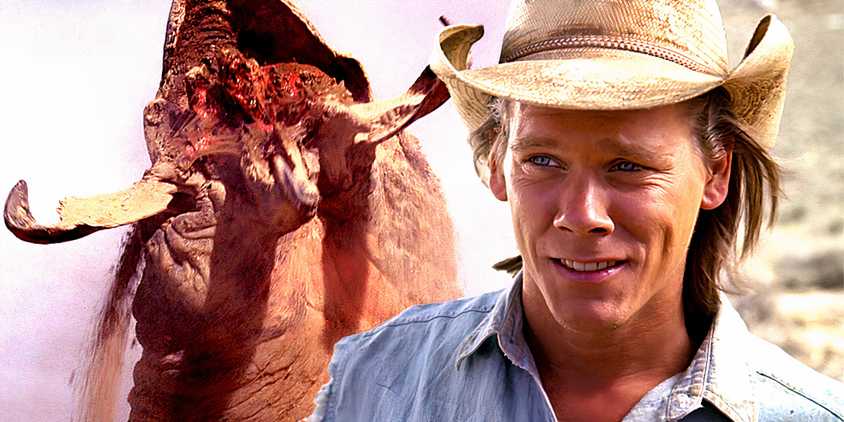 Kevin Bacon as Val smiling cheekily and a graboid flying out of the ground in Tremors