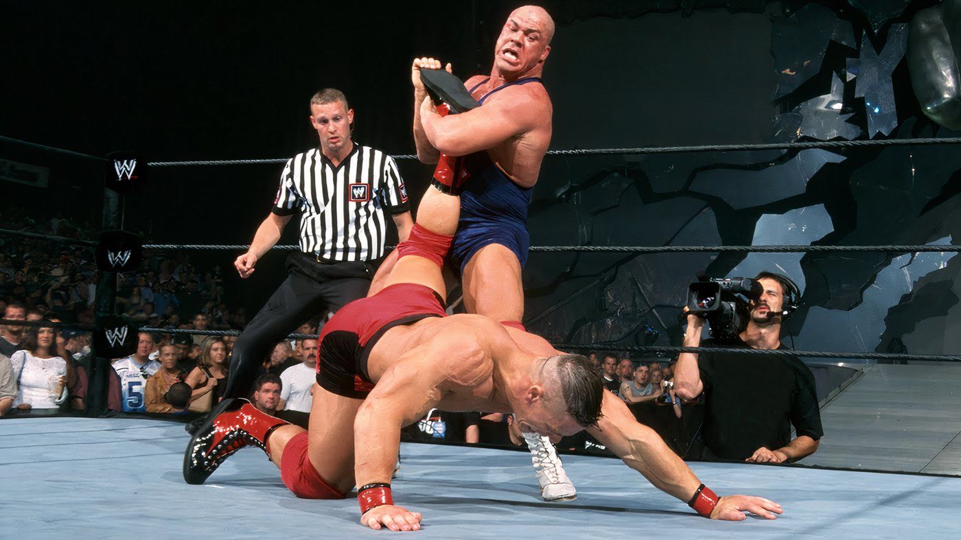 Kurt Angle has the Angle Lock on John Cena during their first match in WWE