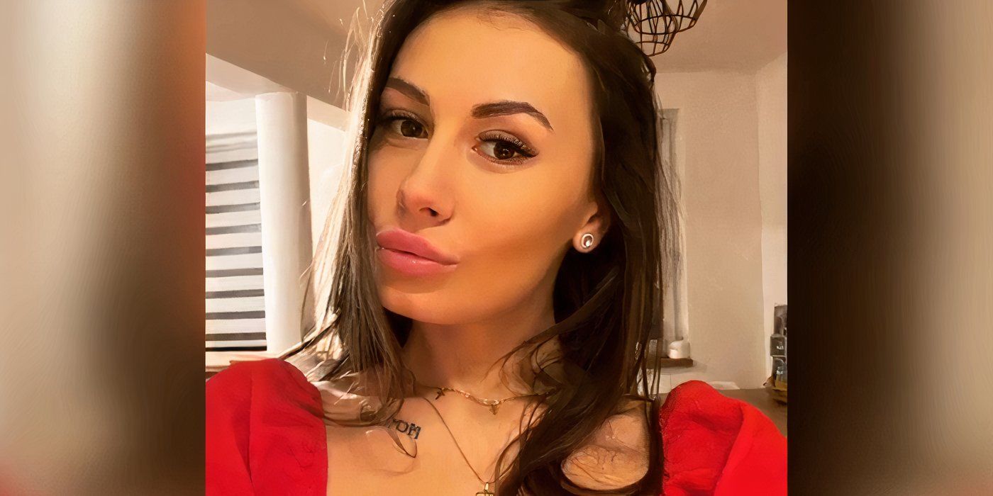 Magda Szlachta In 90 Day Fiance in red dress pouting taking selfie