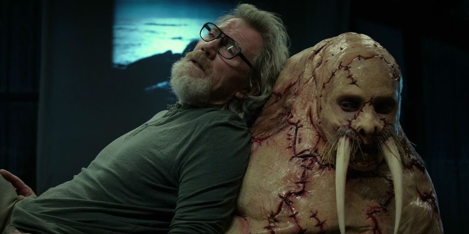 Michael Parks leaning on the walrus in Tusk