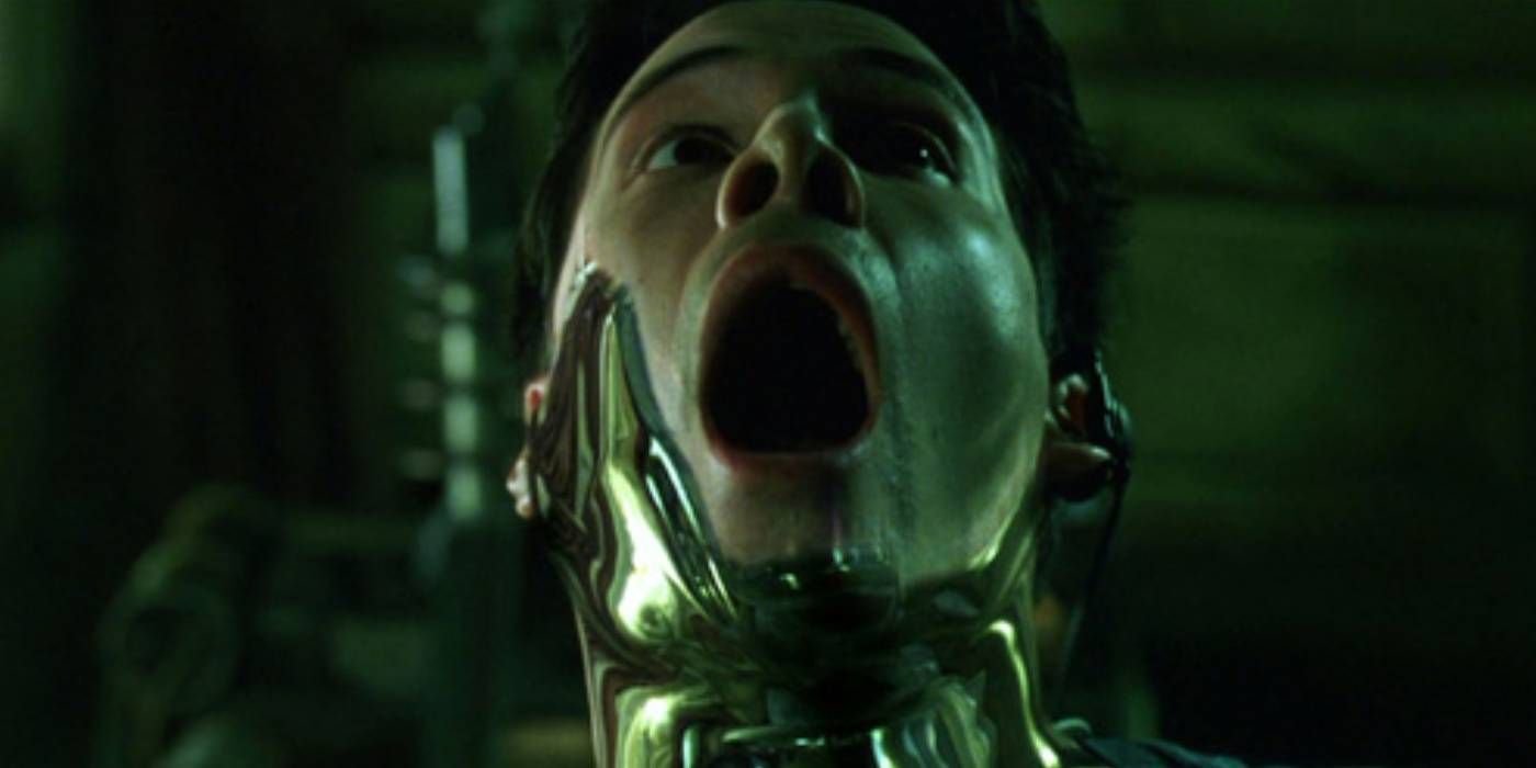 Neo screaming with silver goo around his mouth in The Matrix