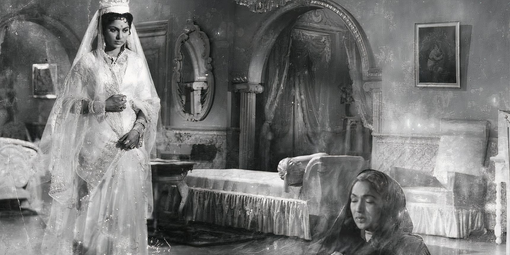 One woman stands in an ornate dress while another is seated with her eyes closed in the Indian thriller Kohraa