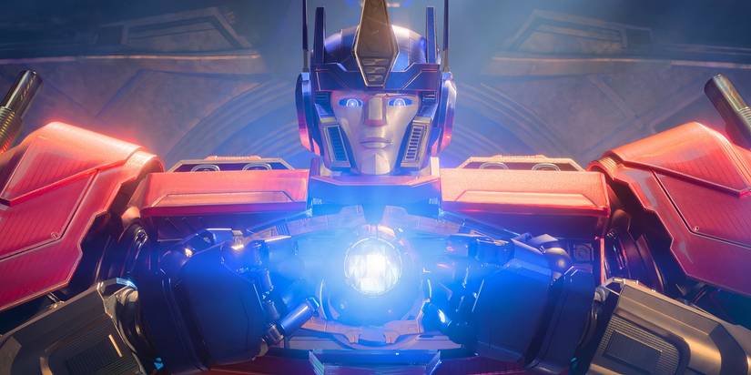 Optimus Prime looking solemn holding the Matrix of Leadership in Transformers One
