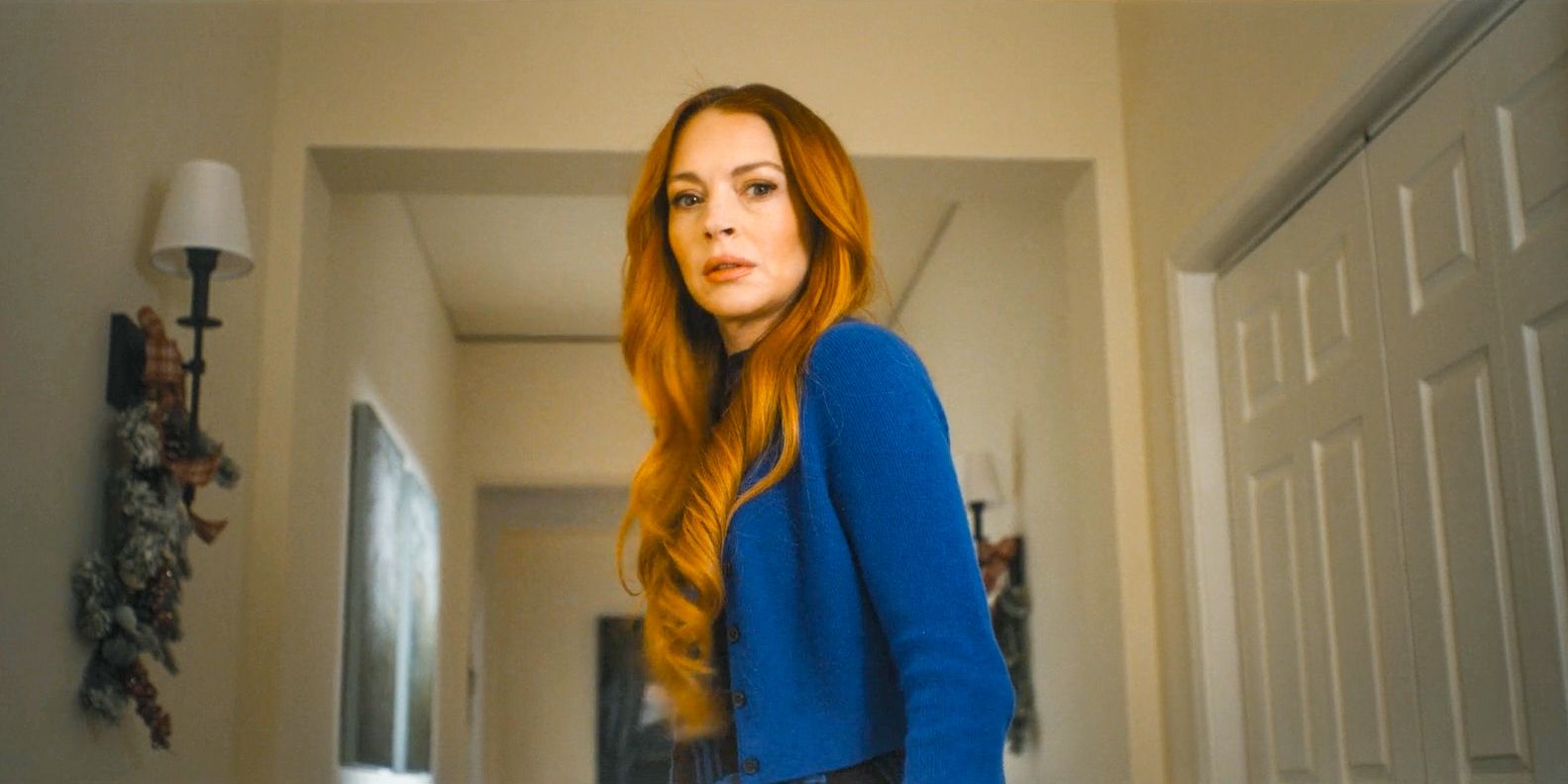 Lindsay Lohan looking down at something nervously in Our Little Secret
