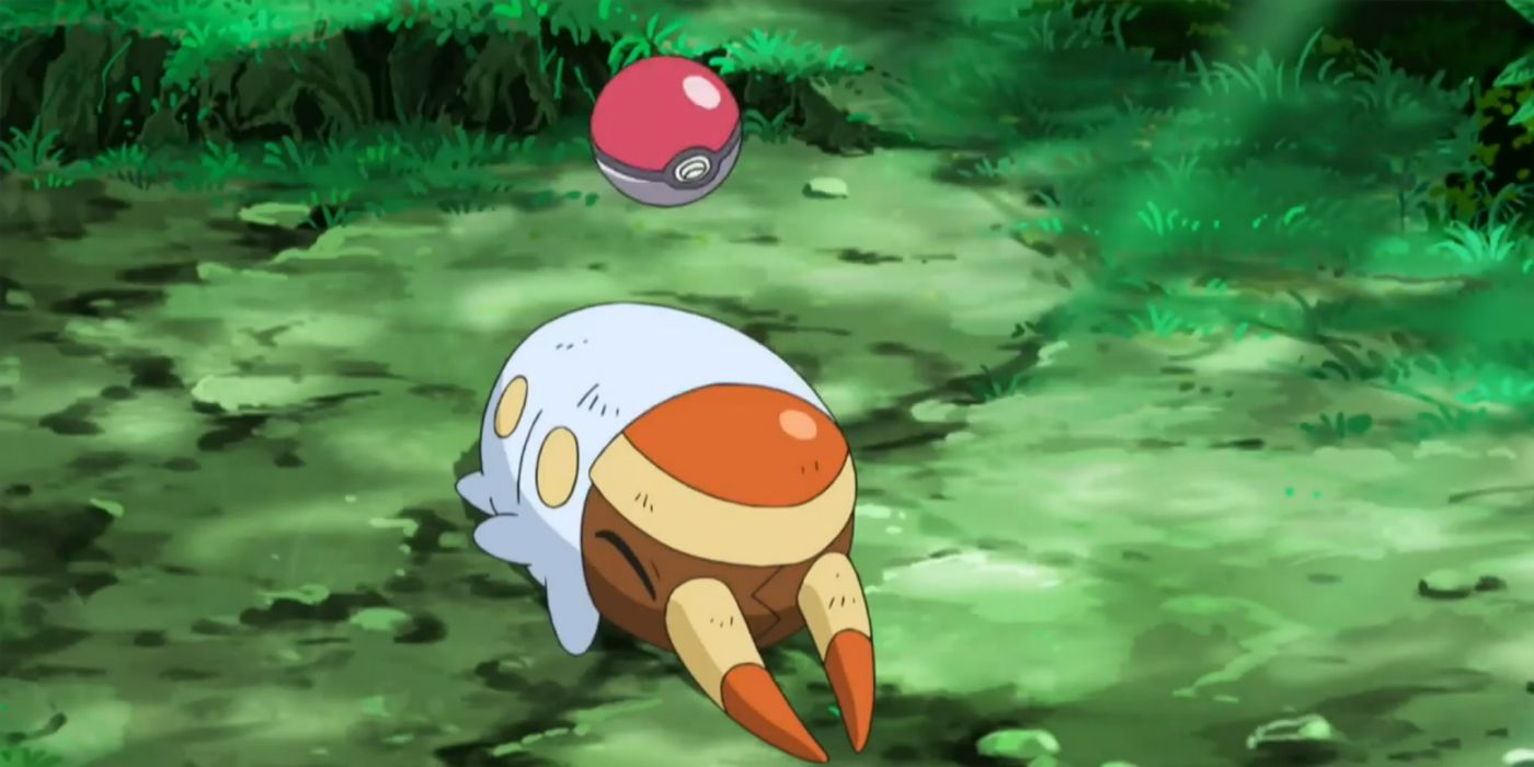 Grubbin a punto de ser capturado en una Poke Ball.