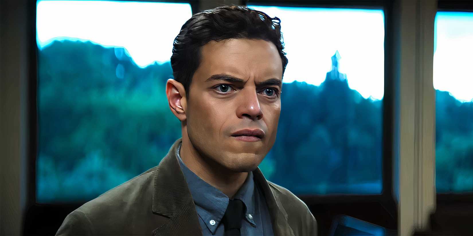 Rami Malek as Charlie looking angrily at something in The Amateur