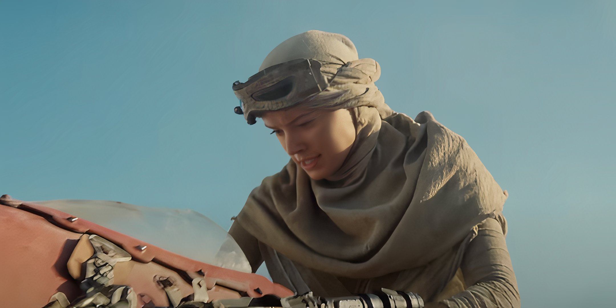 Rey (Daisy Ridley) on her speeder on Jakku in Star Wars The Force Awakens