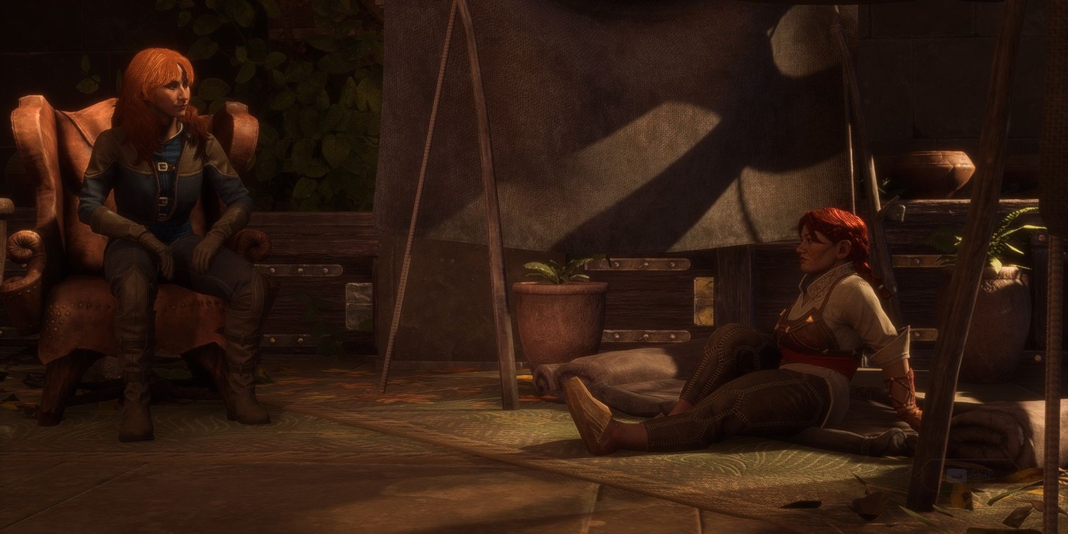 Rook sentado e conversando com Harding em Dragon Age The Veilguard.