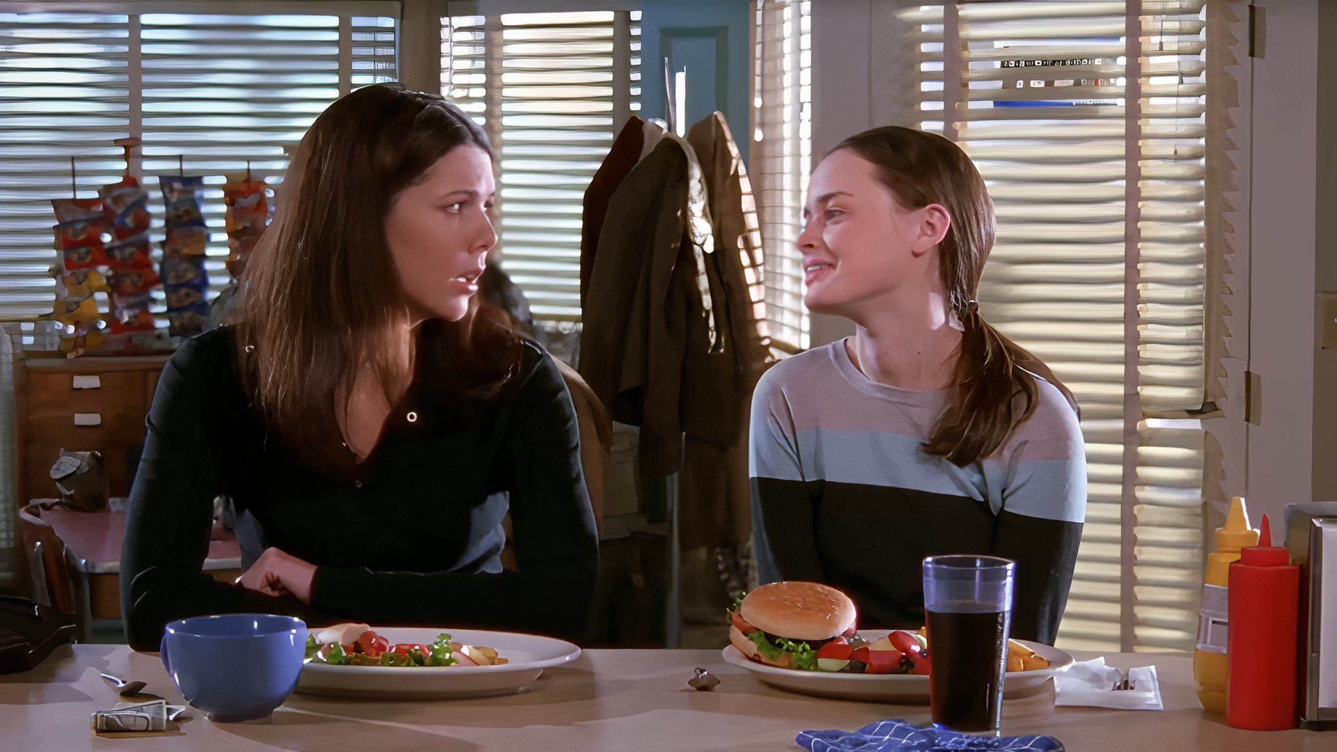 Rory and Lorelai talking in the diner in Gilmore Girls