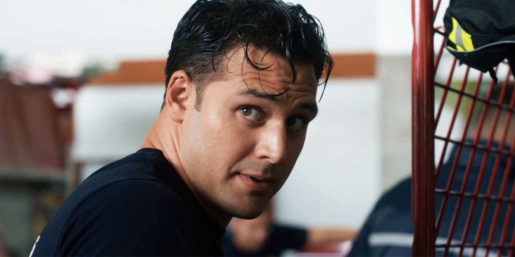 Ryan Guzman as Eddie Diaz in 9-1-1 season 8, episode 8, looking over his shoulder.
