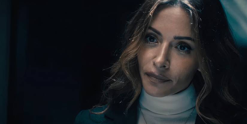 Sarah Shahi looking intently forward in Paradise