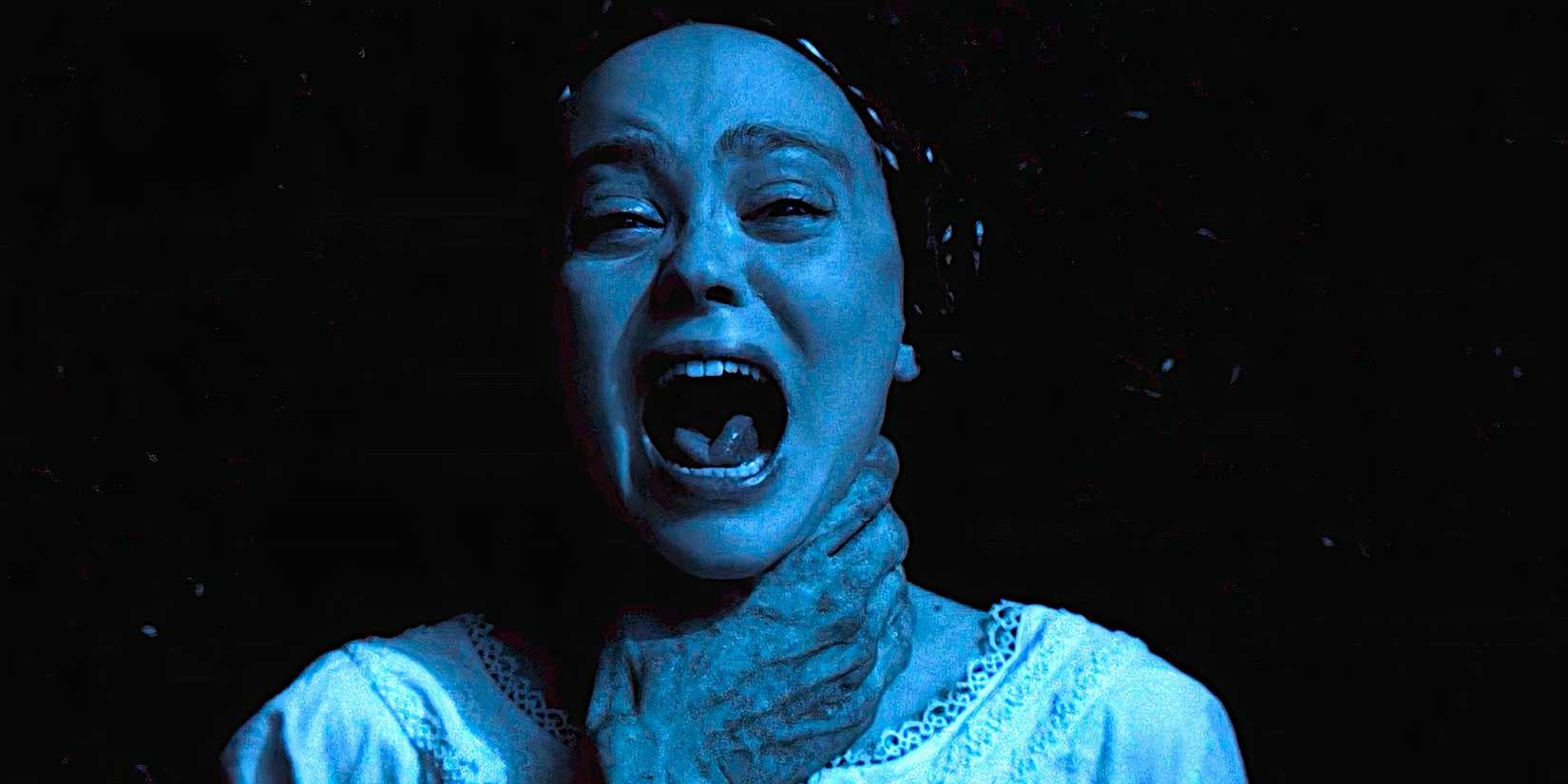 Ellen screams while being strangled by a creepy hand in a scene from Nosferatu 2024