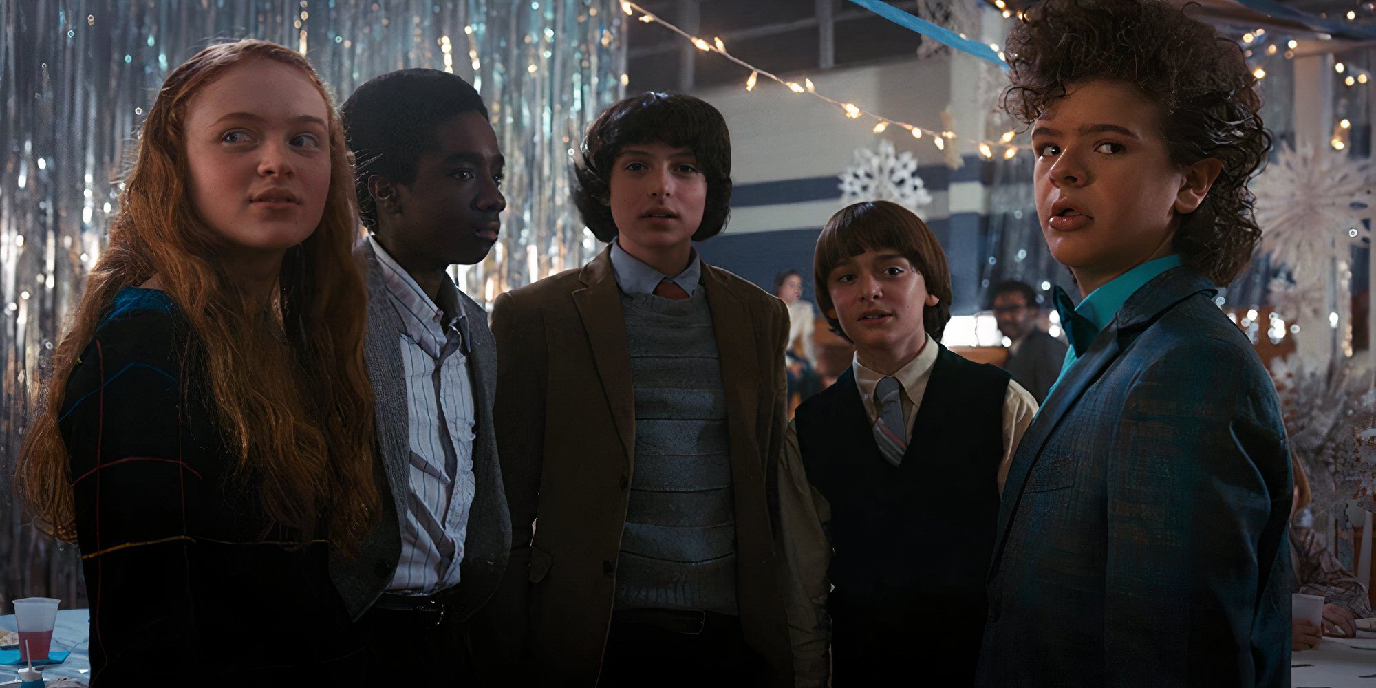 Lucas Dustin Mike Will and Max at the Snowball Dance in the season 2 finale of Stranger Things