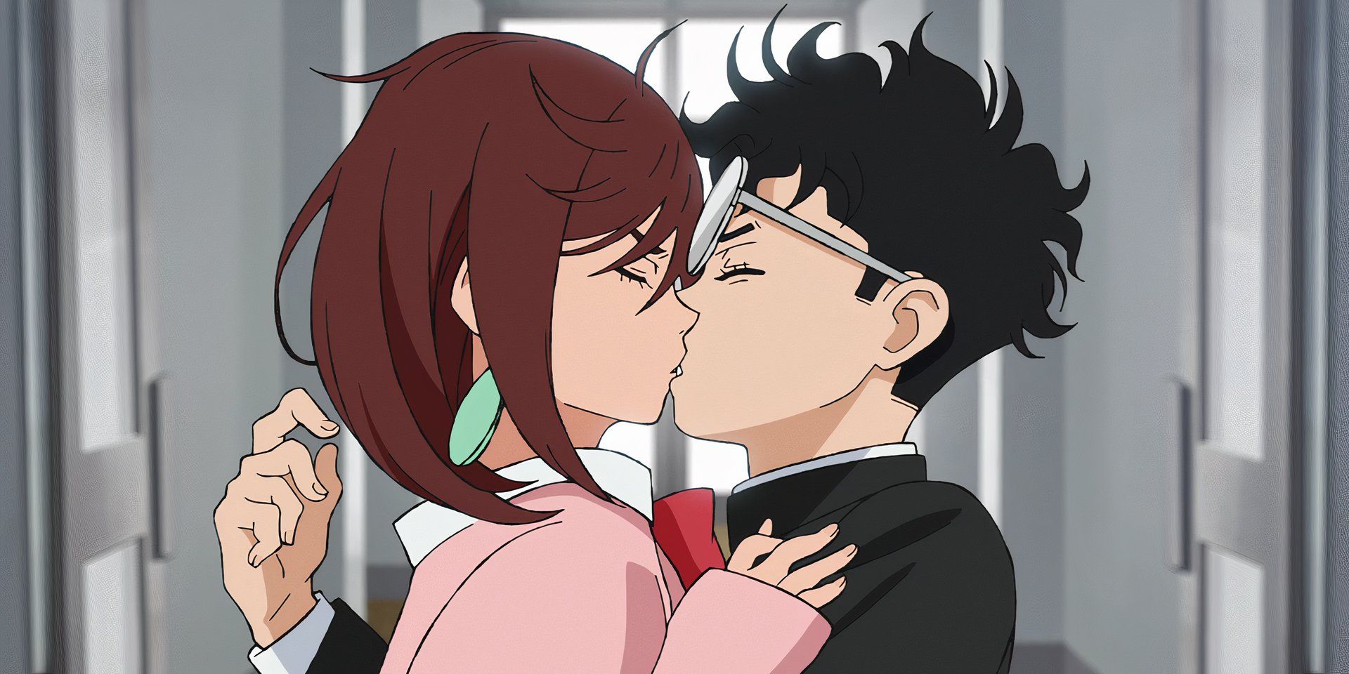 Momo and Okarun bumo into each other and accidentally kiss