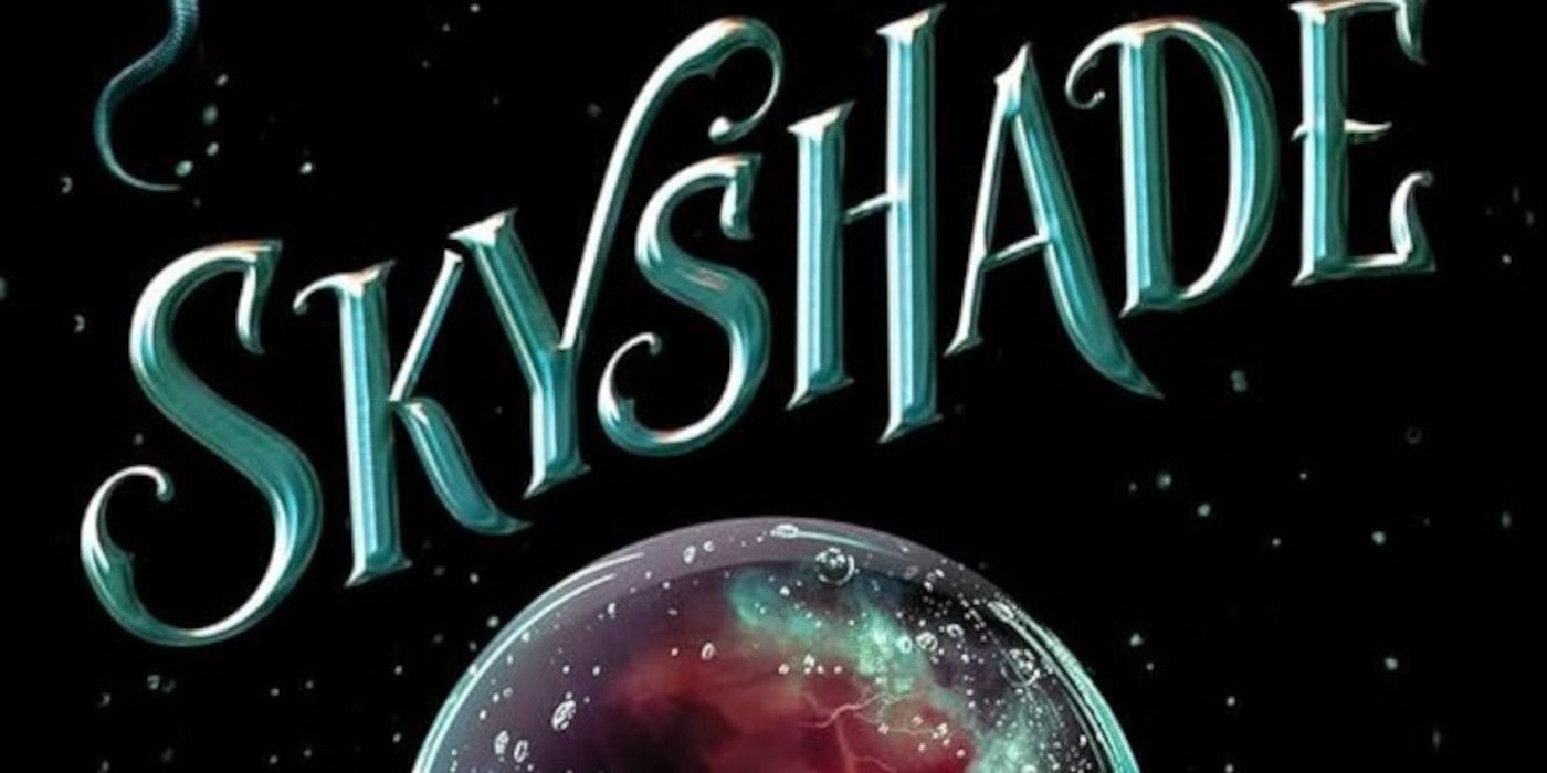 The cover of Skyshade by Alex Aster featuring a black background, the title in blue, and the top of a cystal ball